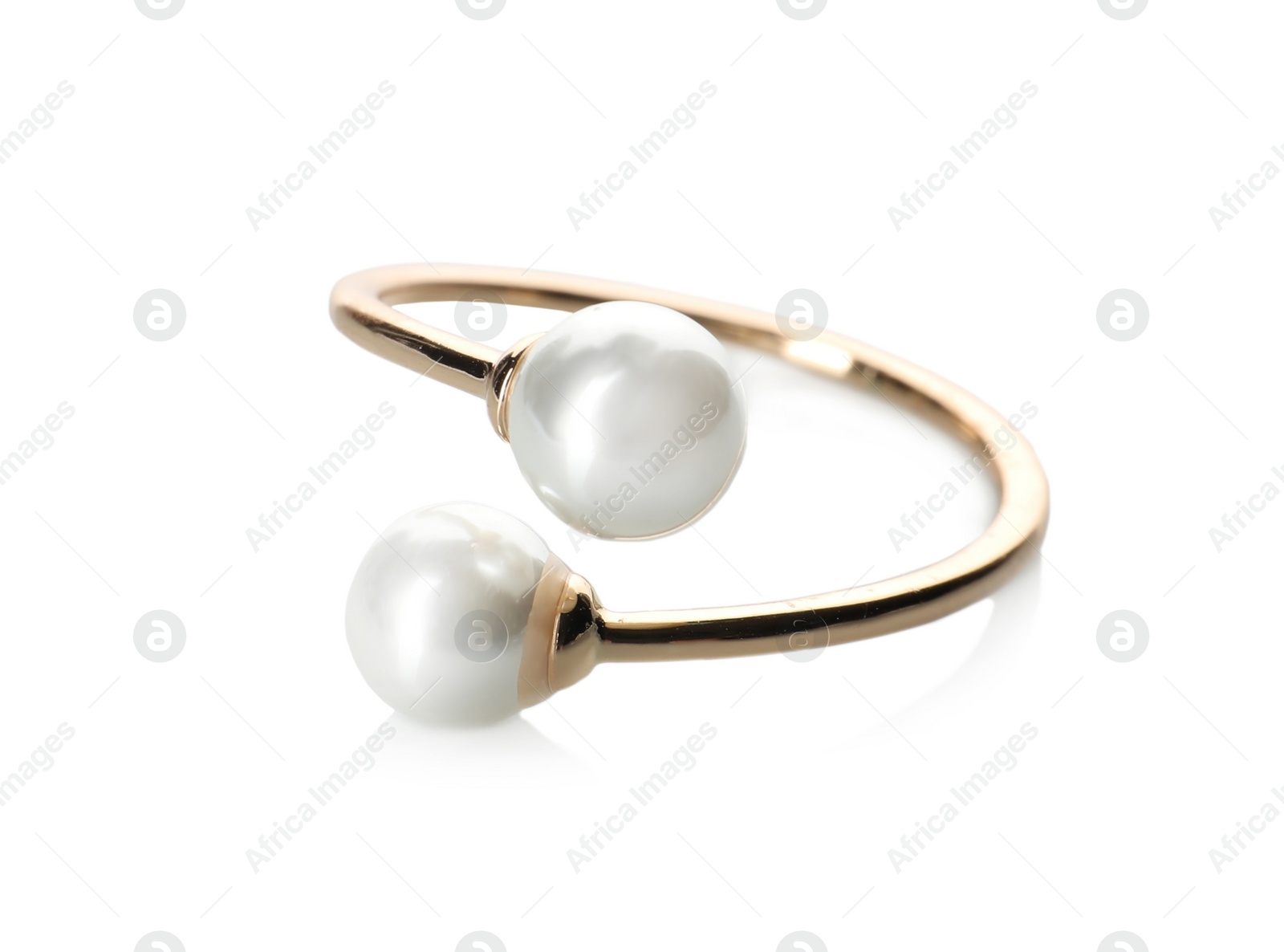 Photo of Elegant golden ring with pearls isolated on white