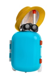 Photo of Stylish little blue suitcase with hat and binocular on white background