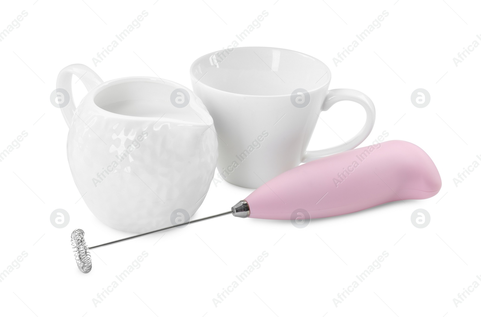 Photo of Milk frother wand, cup and pitcher isolated on white