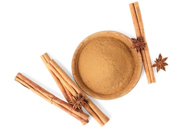 Dry aromatic cinnamon sticks, powder and anise stars isolated on white, top view