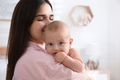 Photo of Mother with her cute baby at home