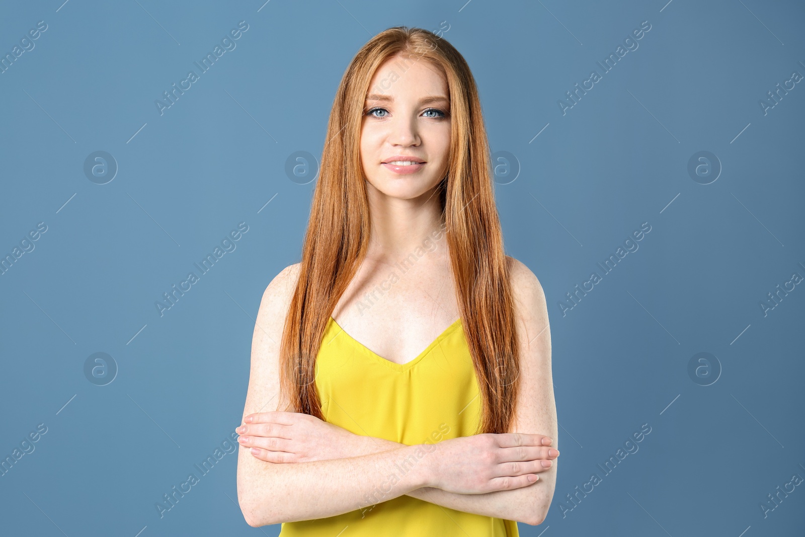 Photo of Portrait of young model with beautiful  hair on color background