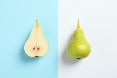 Photo of Ripe juicy pears on color background, top view