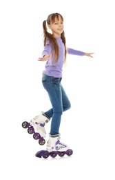 Little girl with inline roller skates on white background