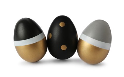 Photo of Three stylish painted eggs on white background