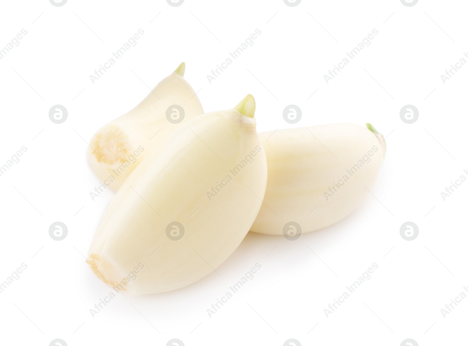 Photo of Peeled cloves of garlic isolated on white