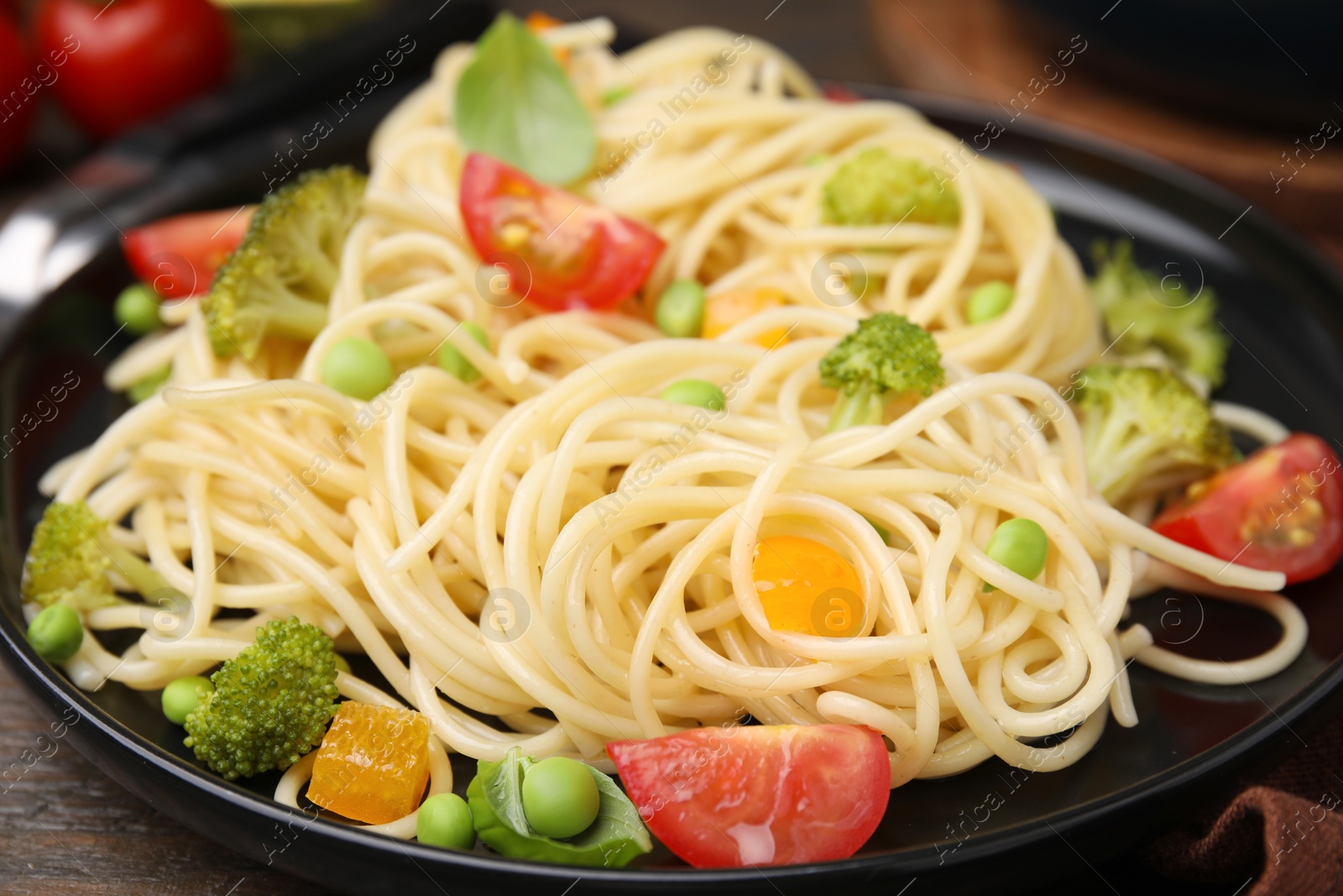 Photo of Plate of delicious pasta primavera, closeup view