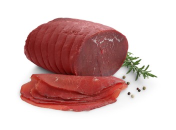 Photo of Tasty fresh dry bresaola, peppercorns and rosemary isolated on white