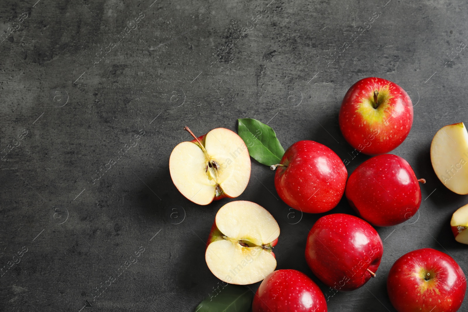 Photo of Fresh ripe red apples on grey background, top view