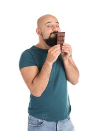 Photo of Overweight man with chocolate bar on white background