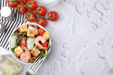 Photo of Tasty salad with croutons, tomato and capers on white textured table, flat lay. Space for text