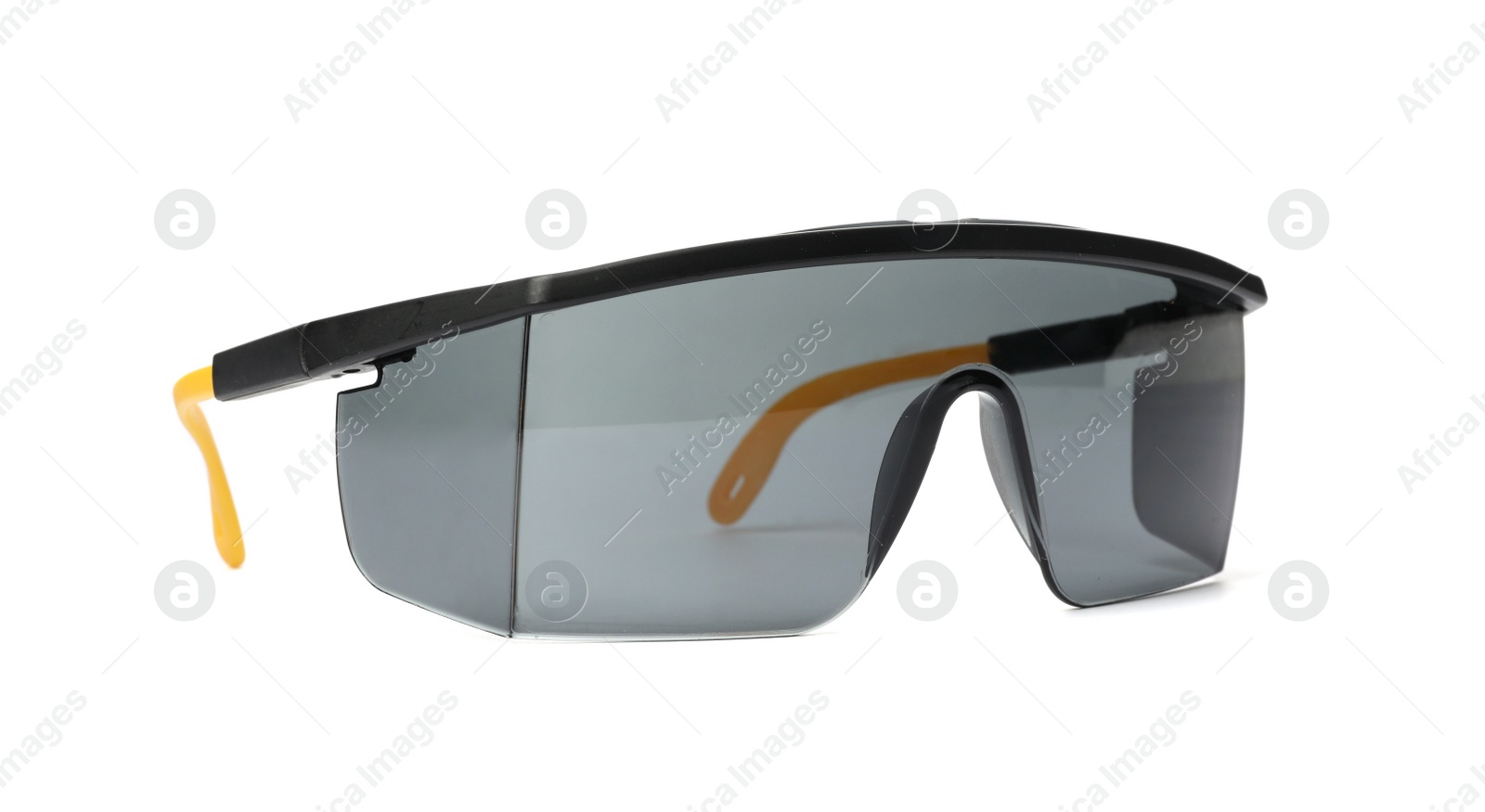 Photo of Protective goggles on white background. Construction tool