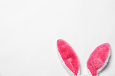 Funny Easter bunny ears on white background, top view