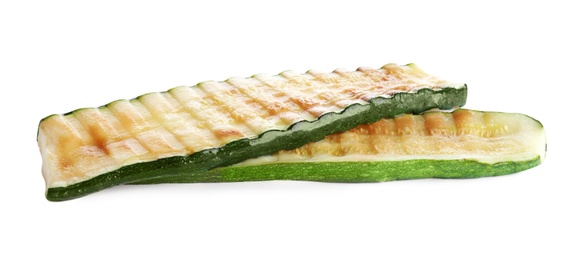 Photo of Delicious pieces of grilled zucchini on white background