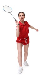 Young woman playing badminton with racket on white background