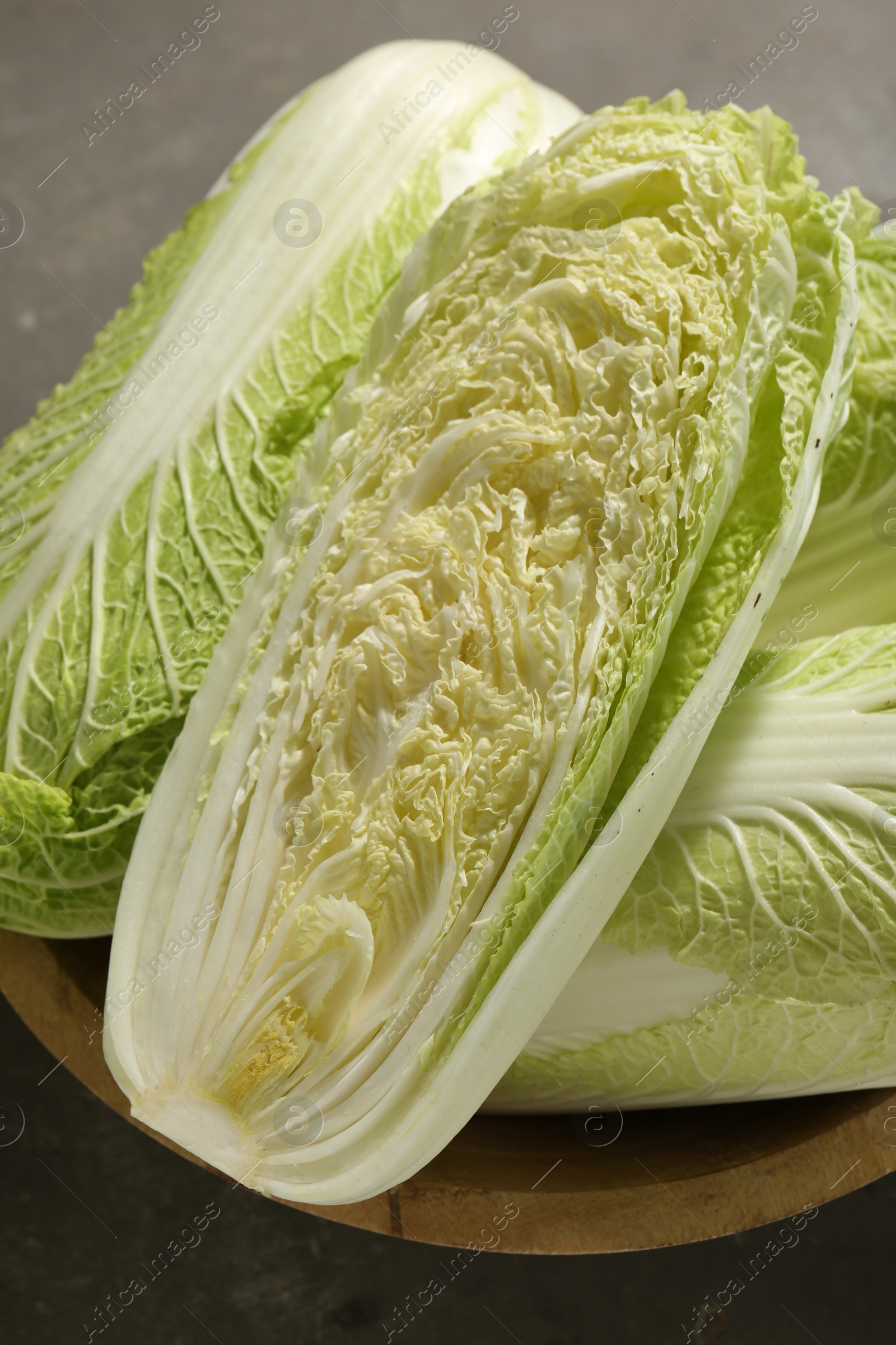 Photo of Fresh ripe Chinese cabbages in bowl on table, top view