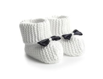 Handmade baby booties with bows isolated on white