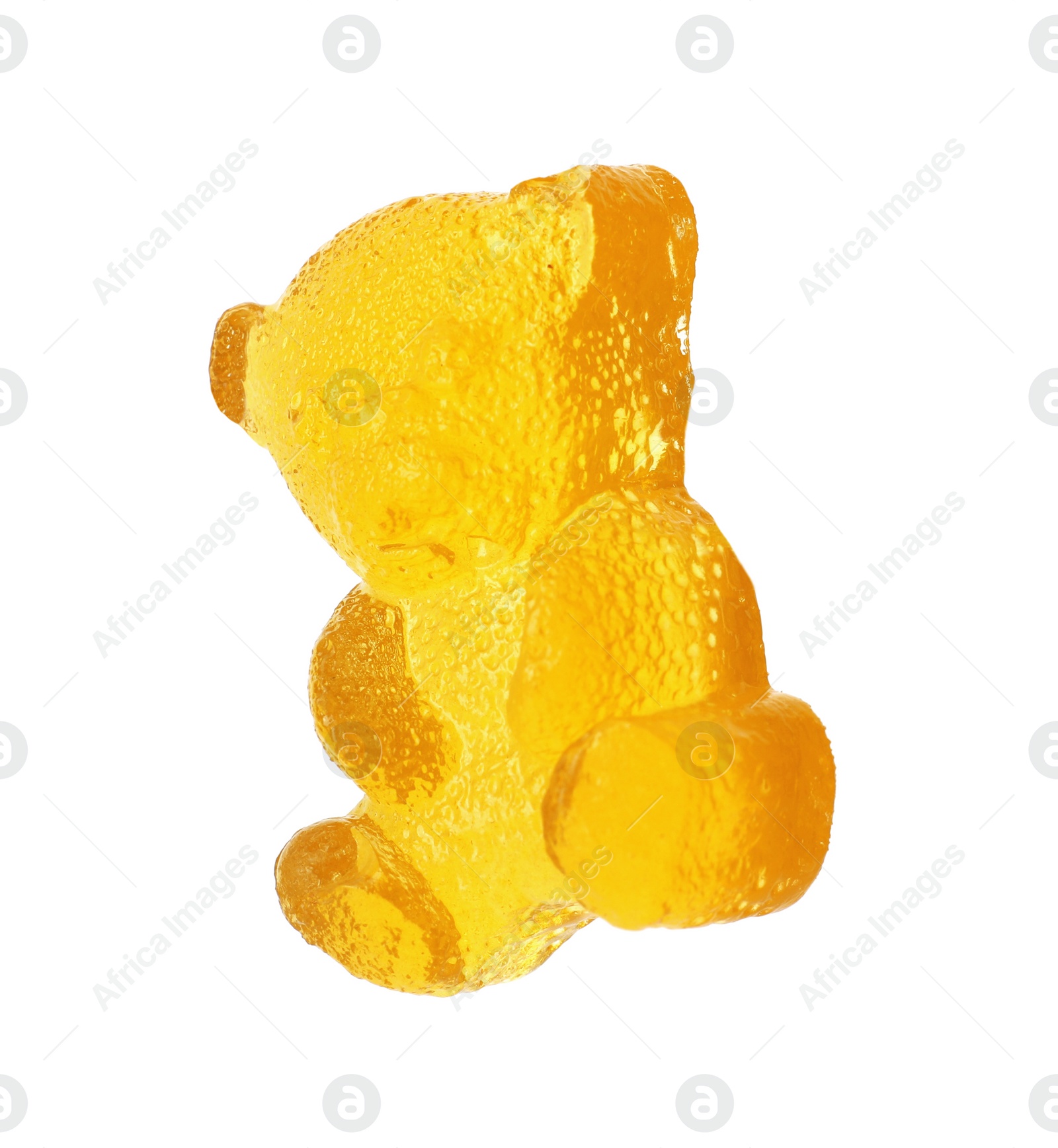 Photo of Delicious yellow gummy bear candy isolated on white