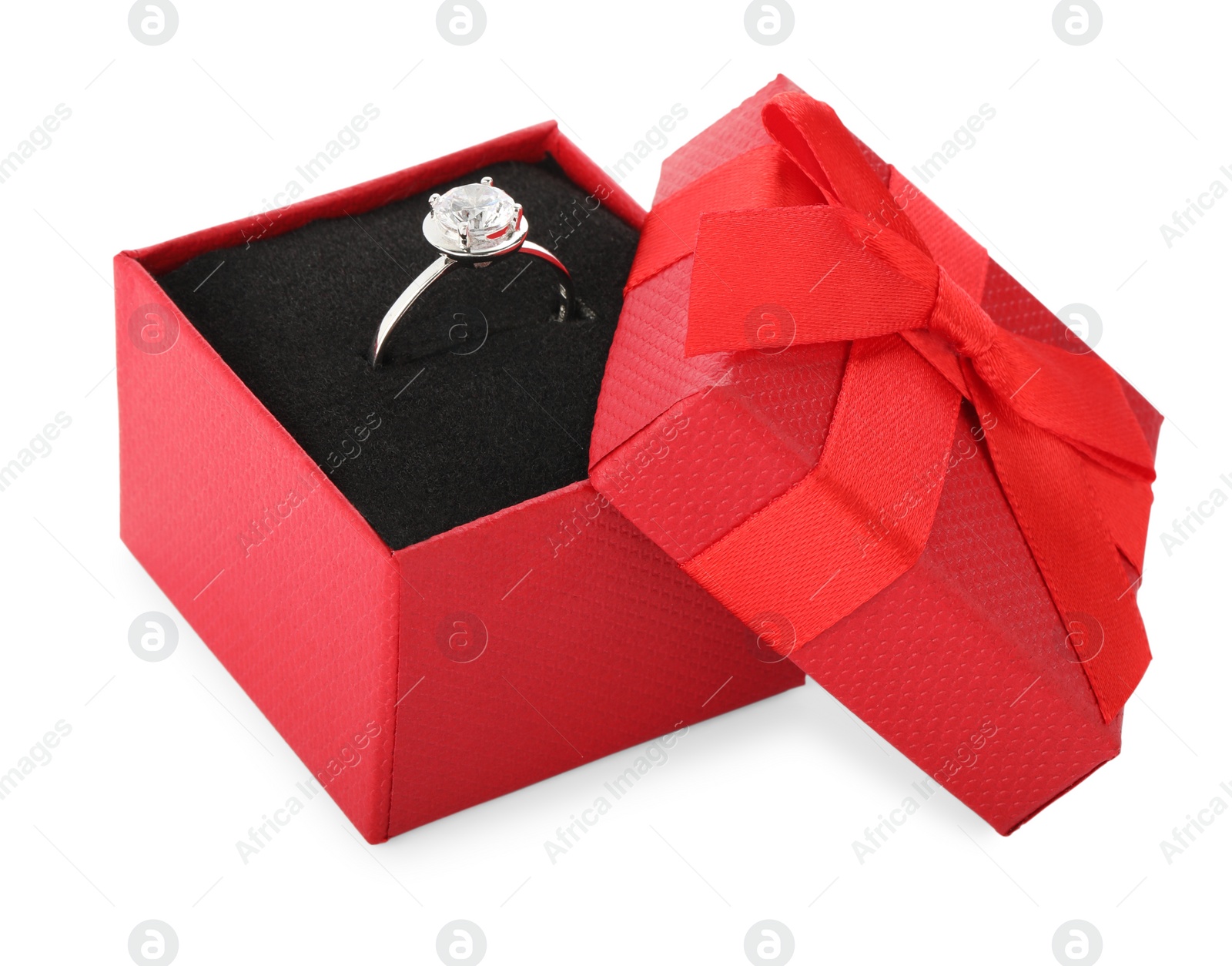 Photo of Beautiful engagement ring with gemstone in box isolated on white