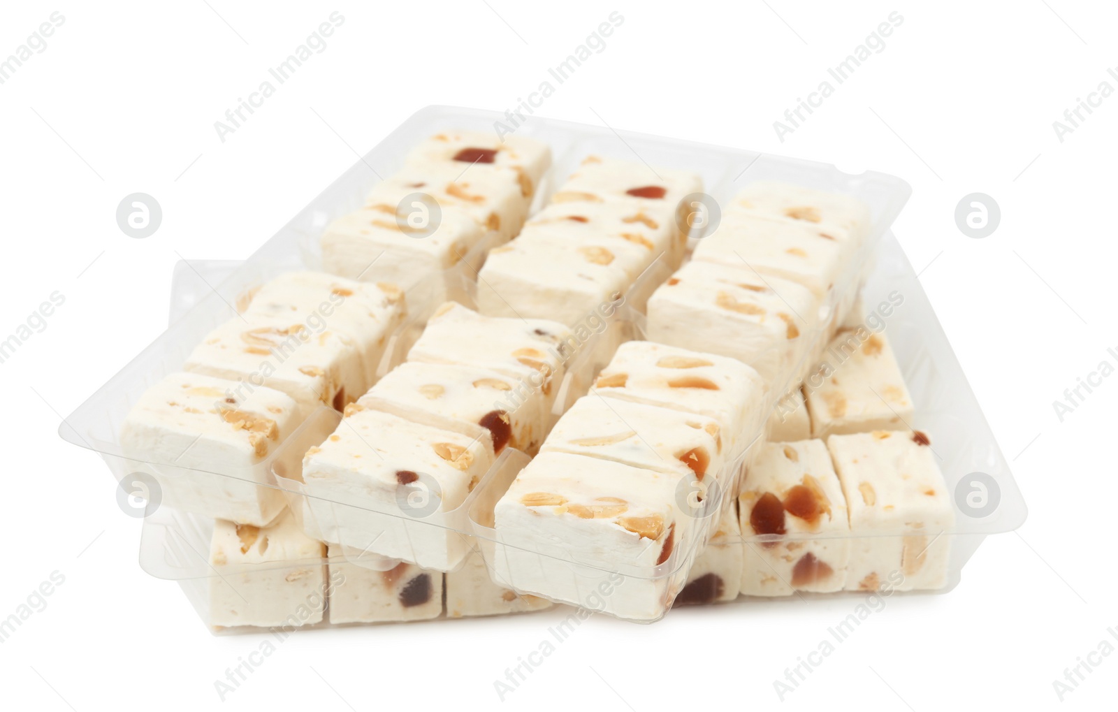 Photo of Plastic containers with pieces of nougat on white background