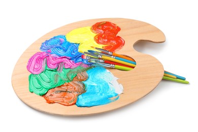 Photo of Palette with paints and brushes on white background. Artist equipment