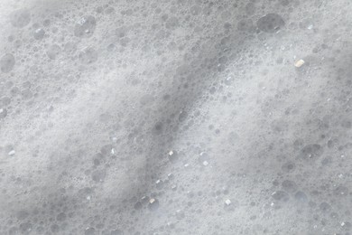 Photo of Fluffy soap foam as background, closeup view