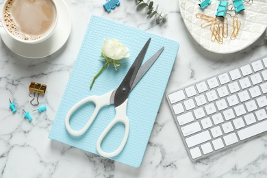 Photo of Flat lay composition with scissors, coffee and keyboard on white marble table