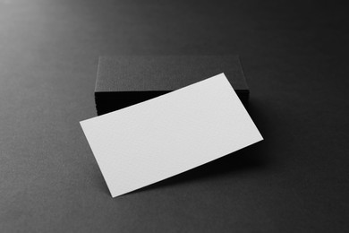 Photo of Blank business cards on black background. Mockup for design