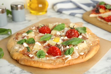 Photo of Delicious homemade pita pizza on white marble table