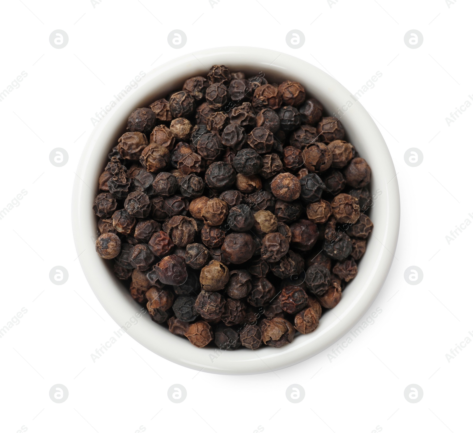 Photo of Aromatic spice. Many black peppercorns in bowl isolated on white, top view