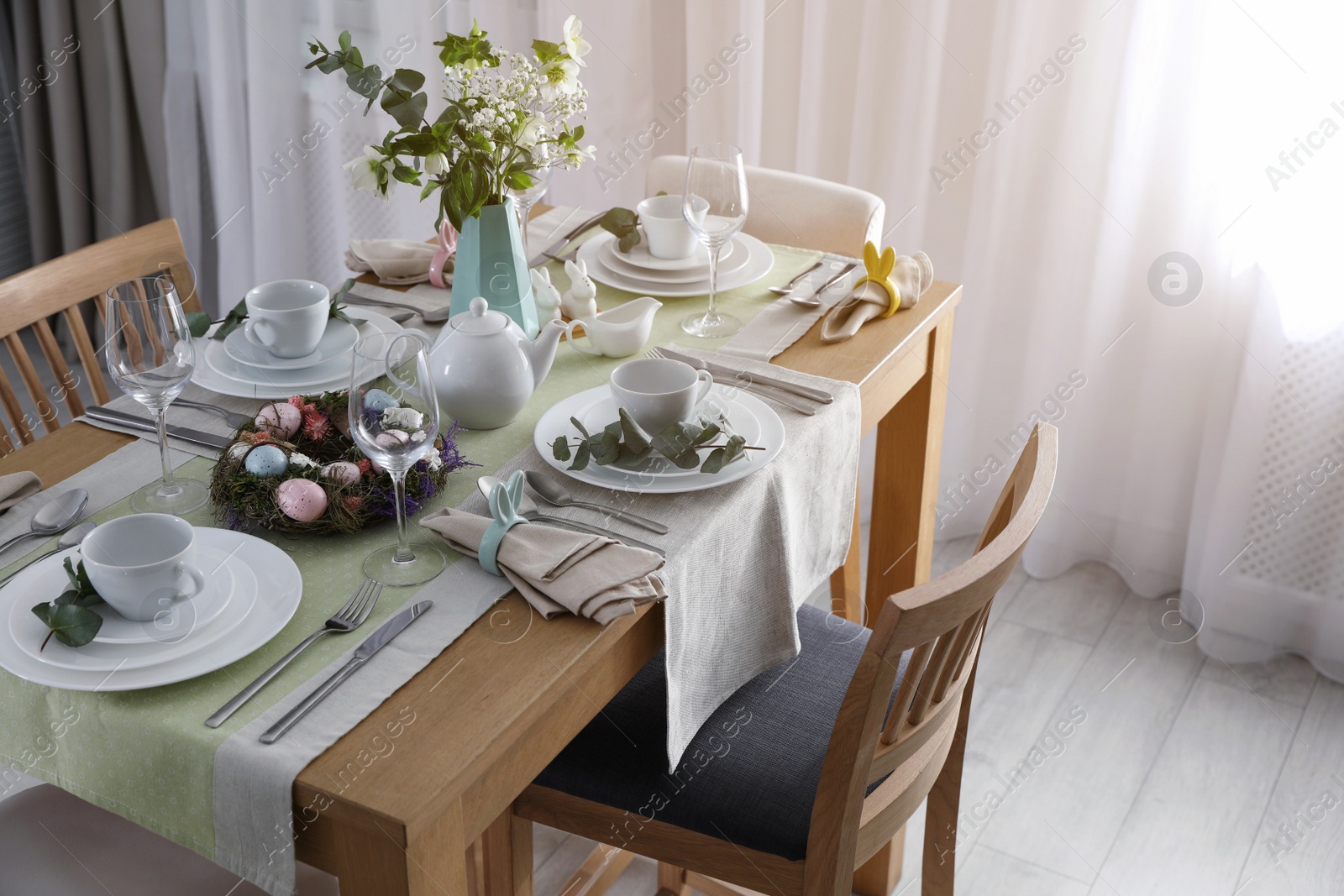 Photo of Beautiful Easter table setting with festive decor indoors