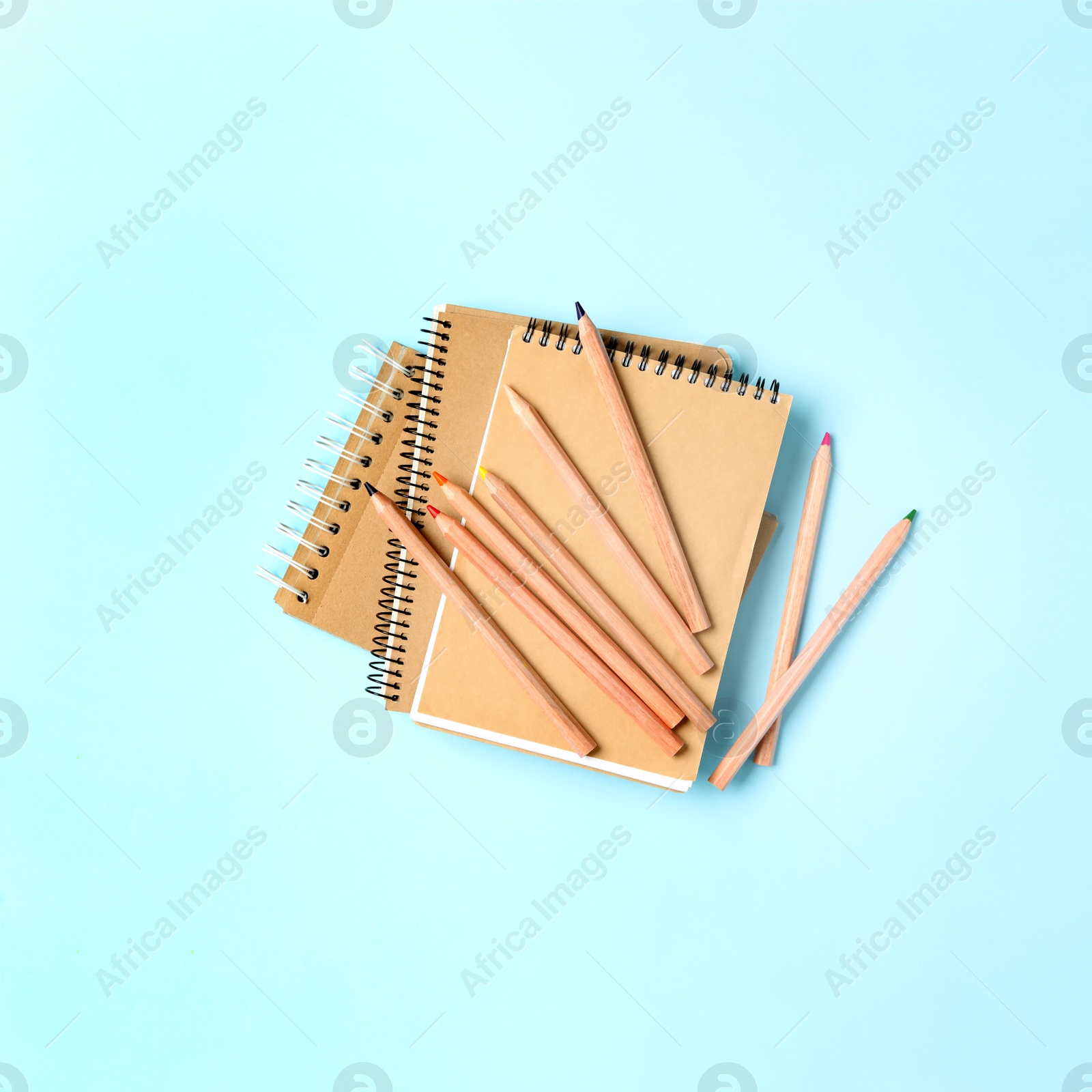 Image of Different school stationery on light blue background, flat lay. Back to school