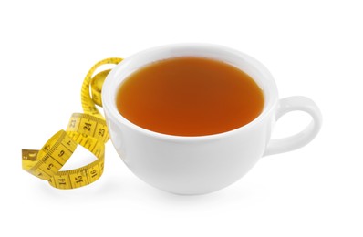 Photo of Ceramic cup of diet herbal tea and measuring tape on white background. Weight loss