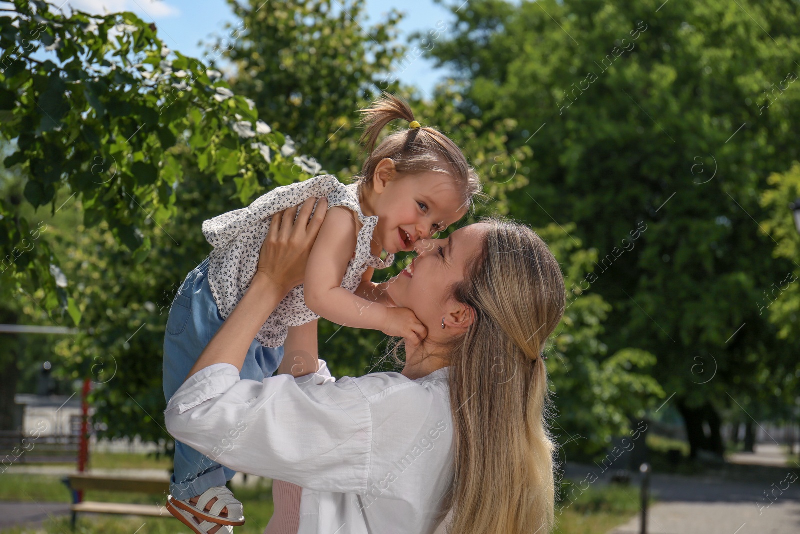 Photo of Happy mother with her daughter spending time together in park