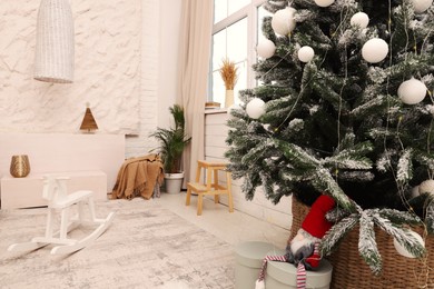 Photo of Room interior with Christmas tree and festive decor
