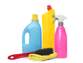 Photo of Different cleaning products and brush on white background