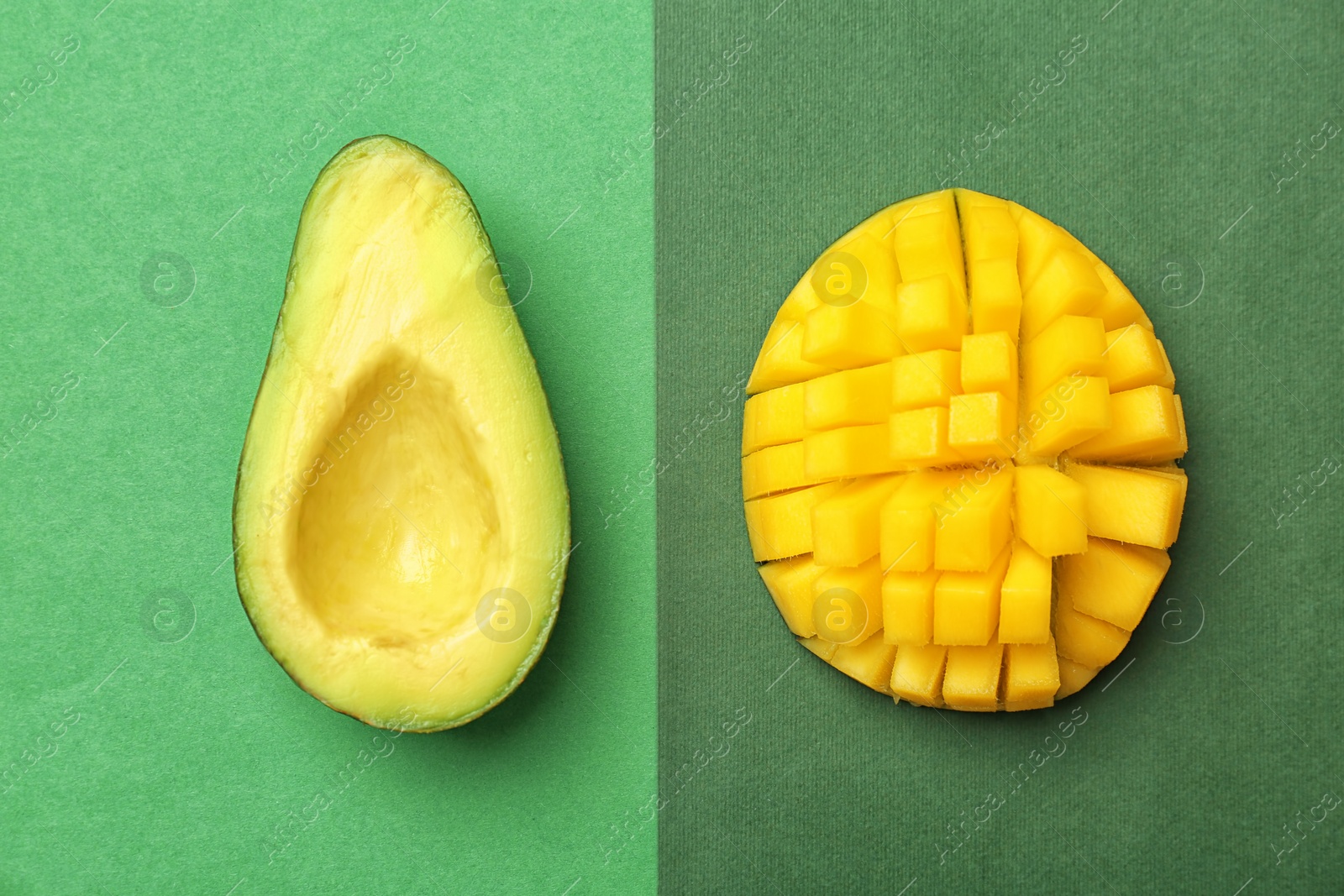 Photo of Flat lay composition with ripe avocado and mango on color background