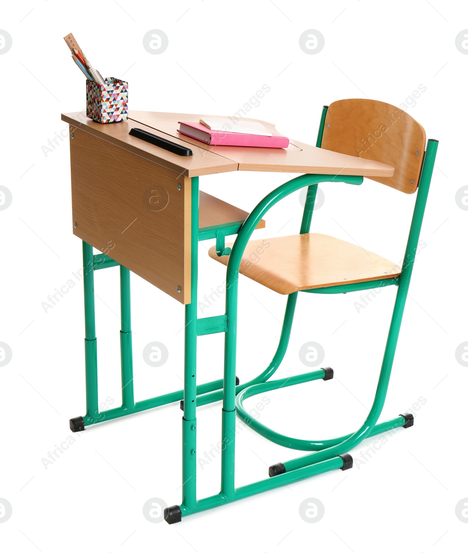 Photo of Wooden school desk with stationery on white background