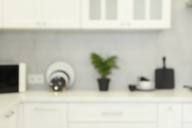 Photo of Blurred view of modern kitchen. Interior design