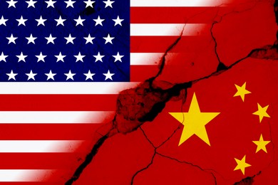 Image of Flags of USA and China on broken wall. International diplomatic relationships