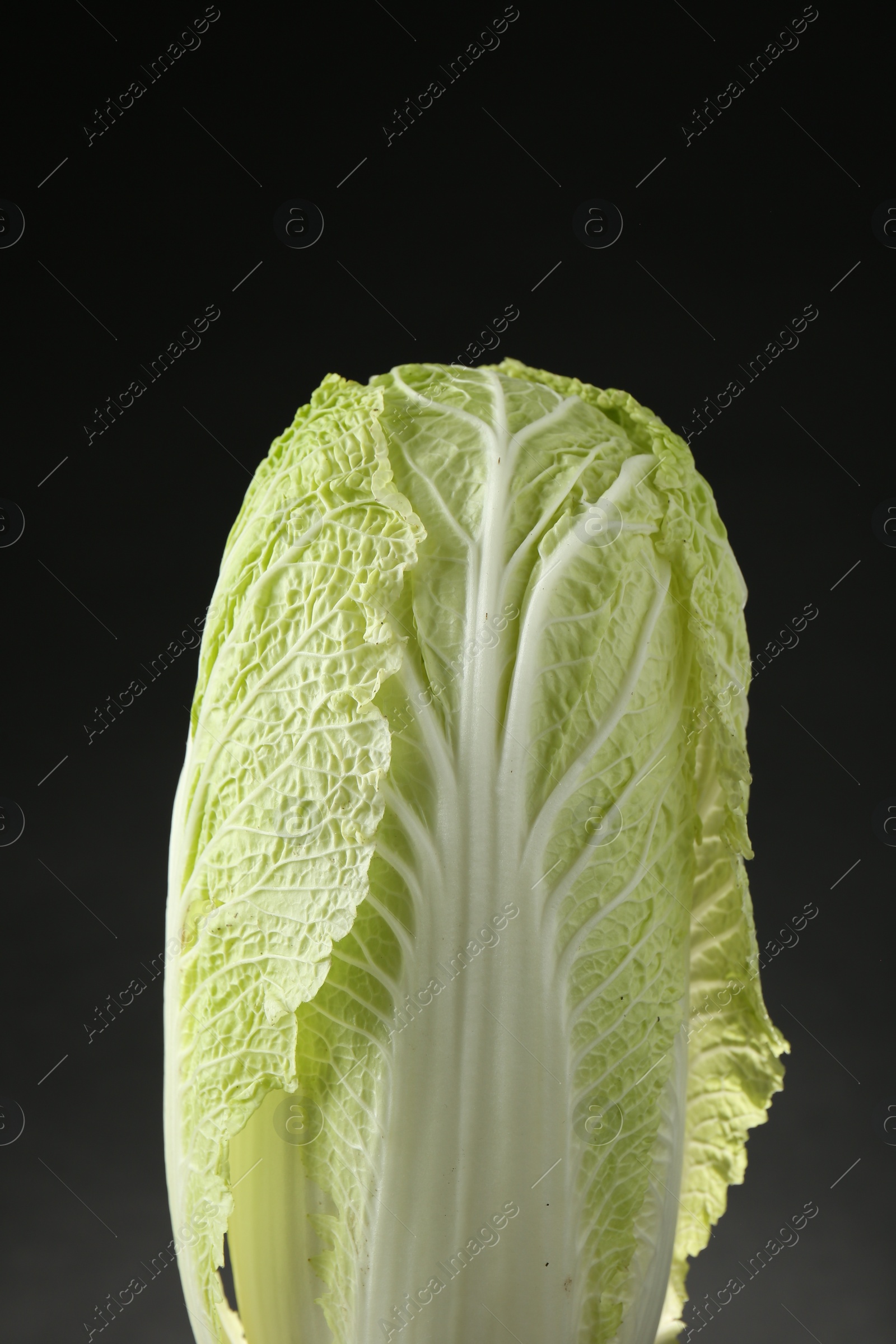 Photo of Fresh ripe Chinese cabbage on black background