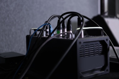 Audio mixing console on table in recording studio