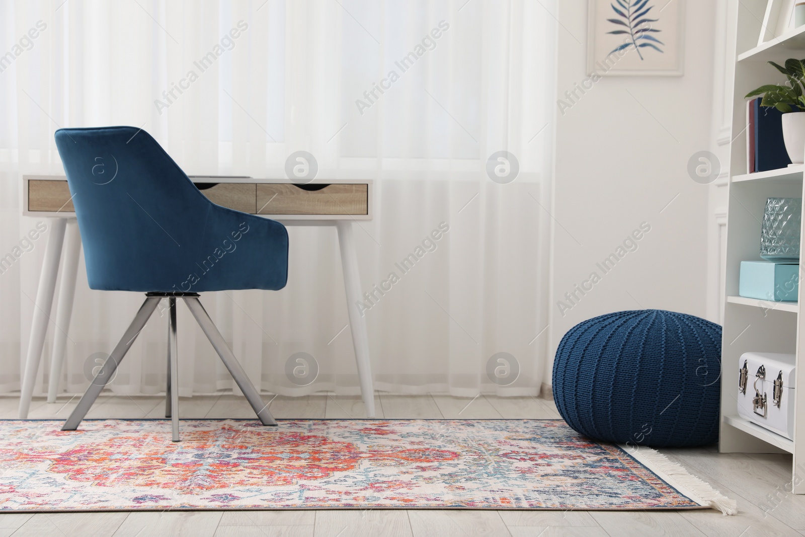 Photo of Stylish room with beautiful rug and furniture. Interior design