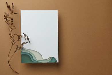Photo of Blank invitation card and dry branch on beige background, top view. Space for text
