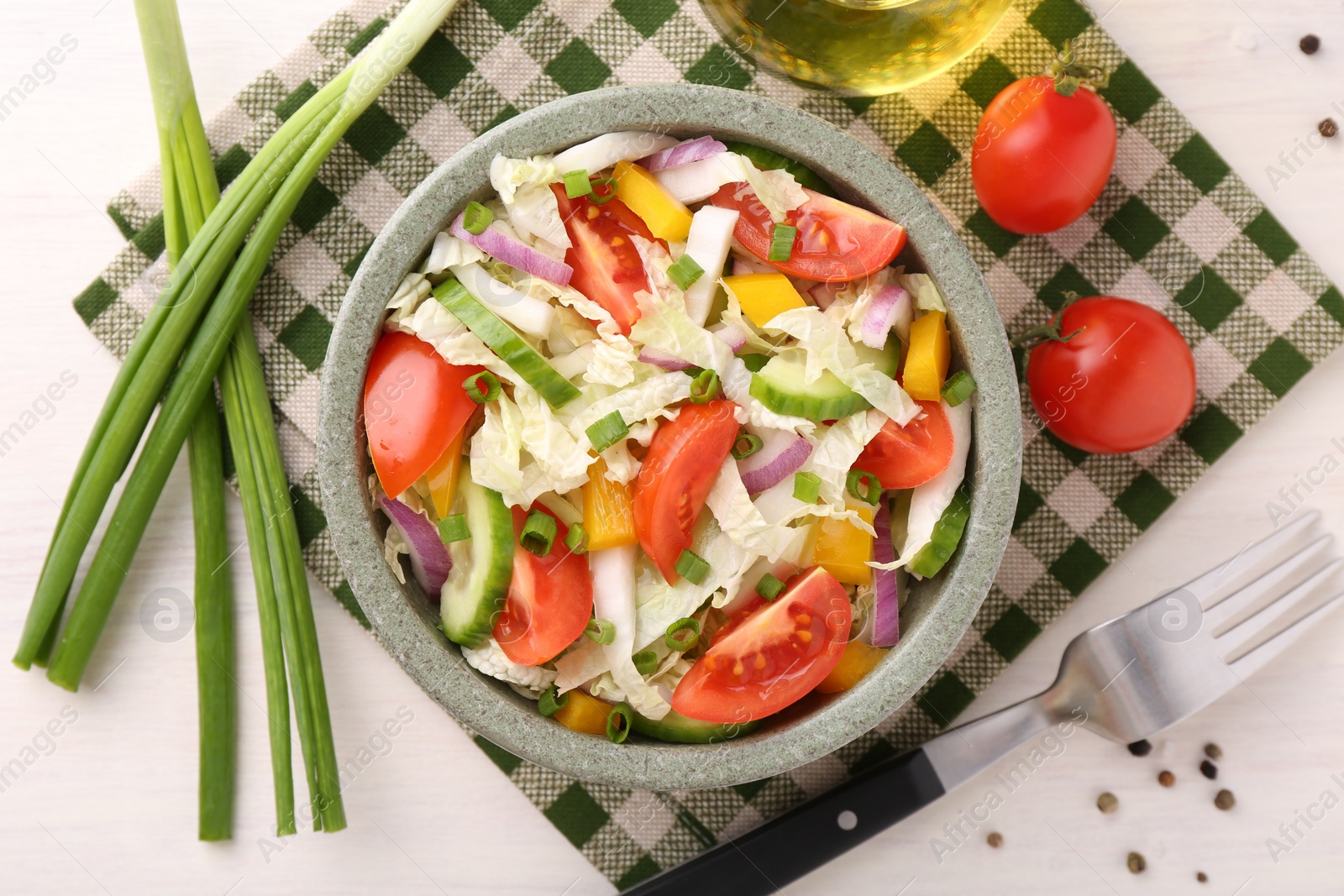 Photo of Tasty salad with Chinese cabbage served on white wooden table, flat lay