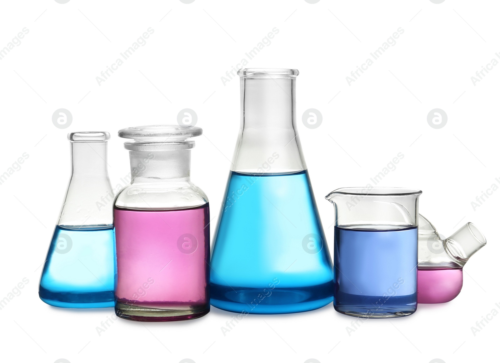 Photo of Laboratory glassware with colorful liquids on white background