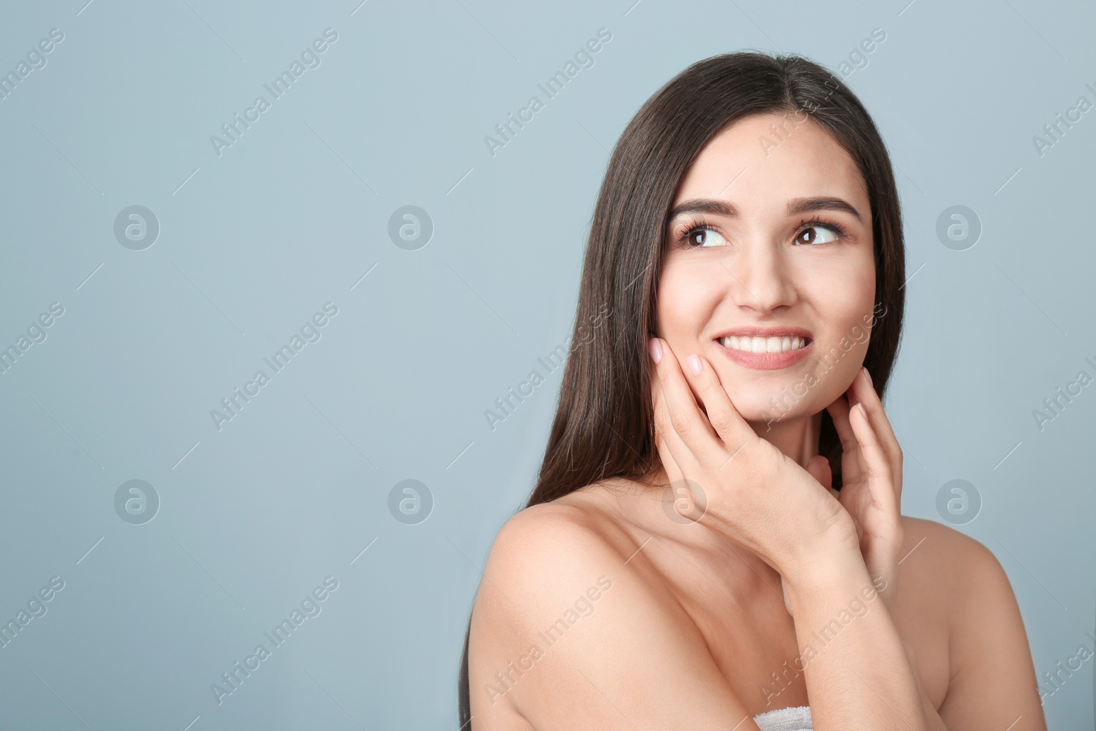 Photo of Portrait of beautiful woman on color background. Cosmetology and spa