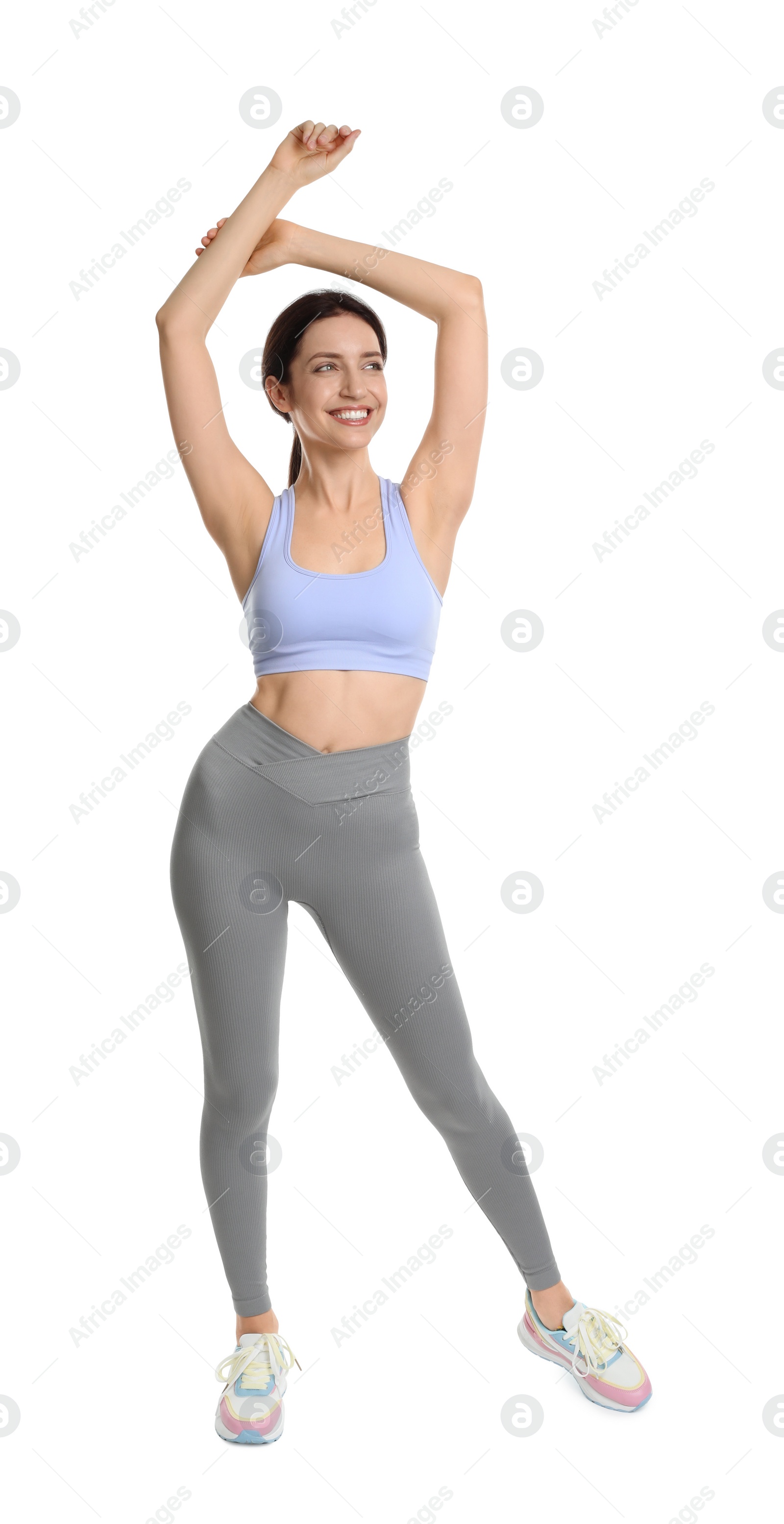 Photo of Happy young woman with slim body posing on white background