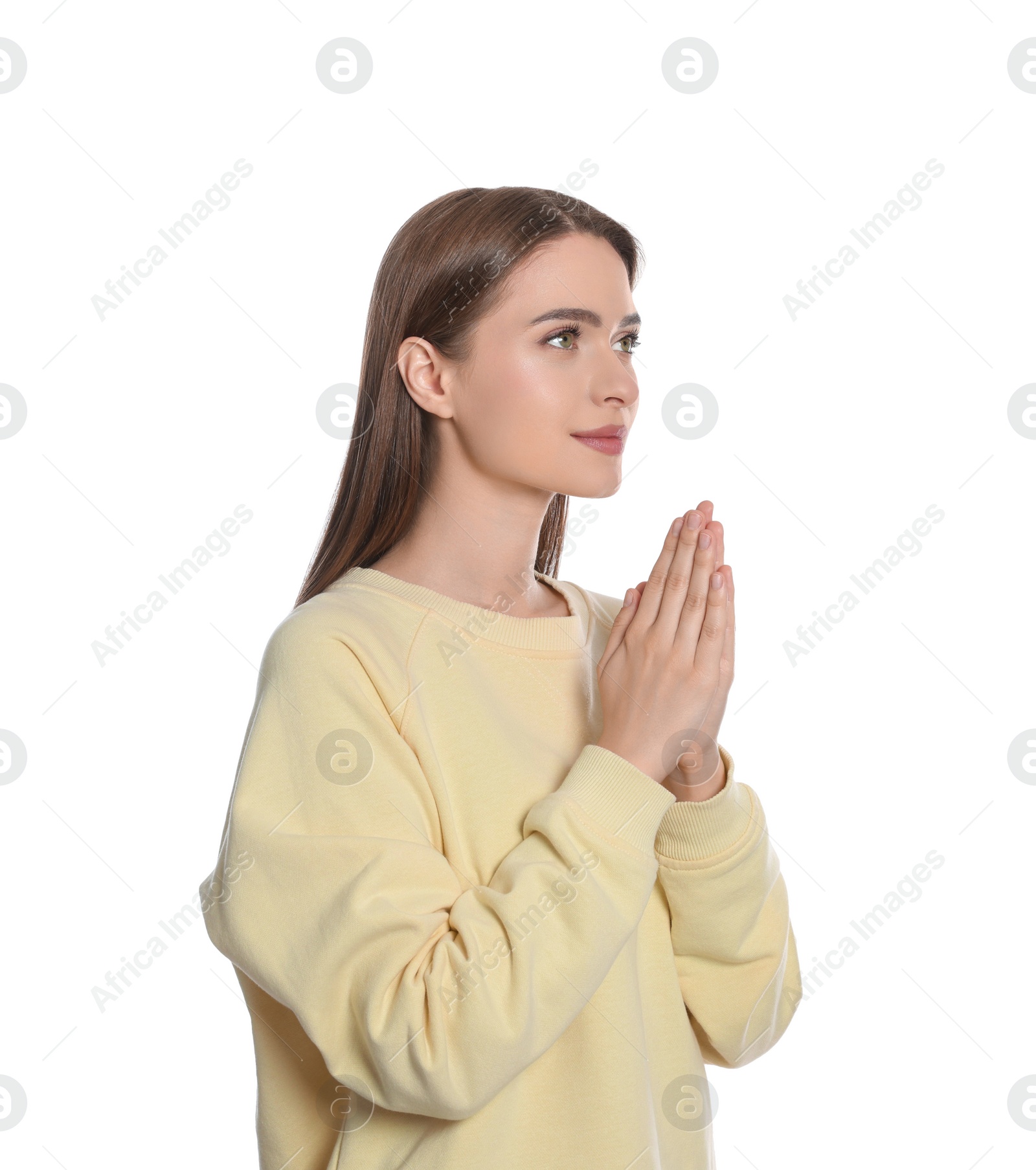 Photo of Woman with clasped hands praying on white background