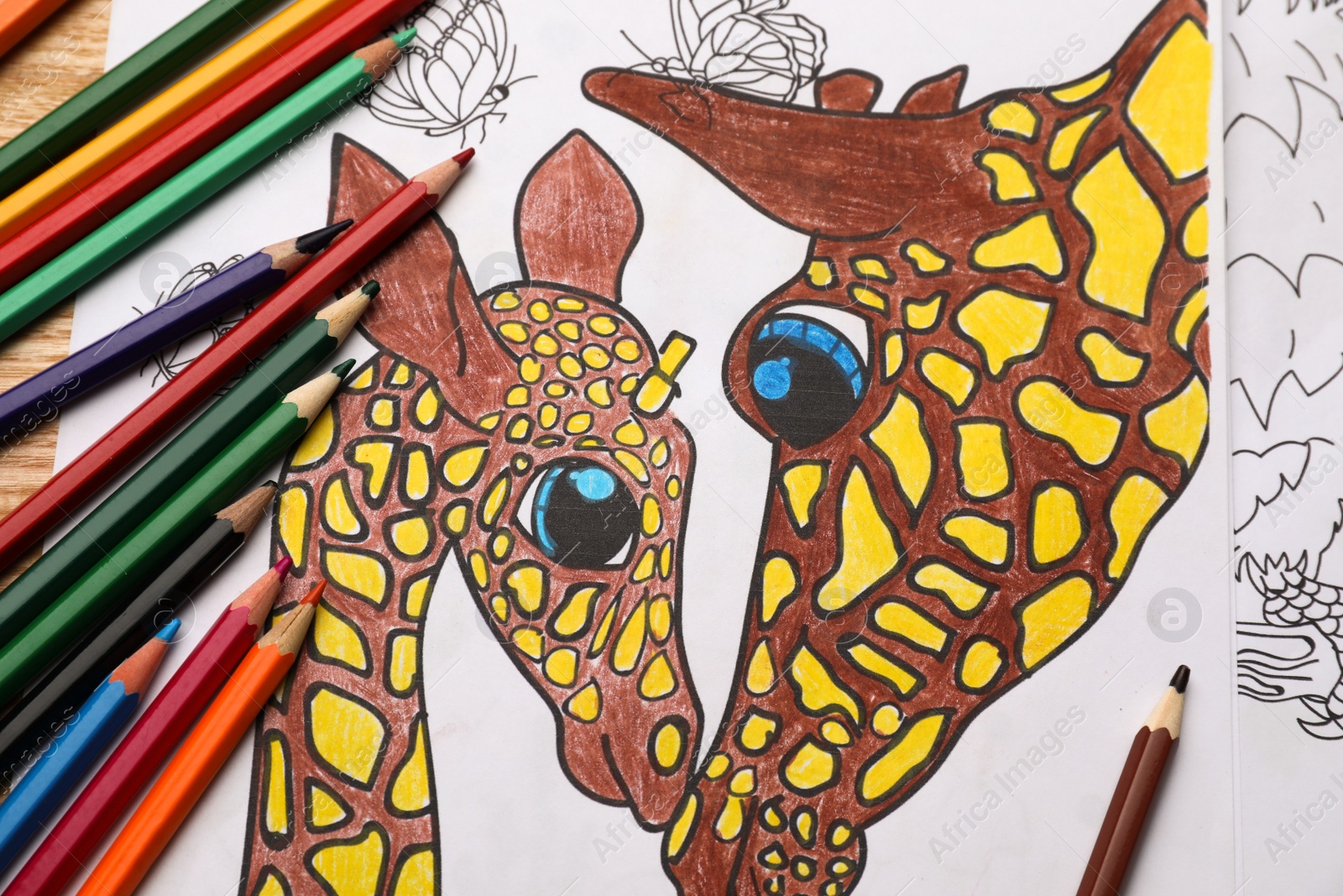 Photo of Child's colored drawing with pencils, flat lay